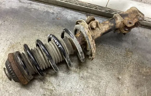 Opel Zafira B Front shock absorber with coil spring