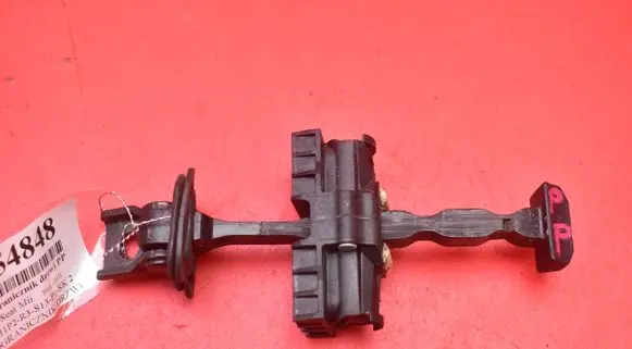 Front door check strap stopper