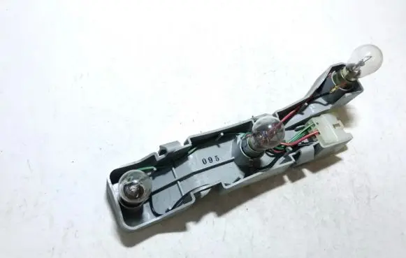 Mazda 323 Tail light bulb cover holder