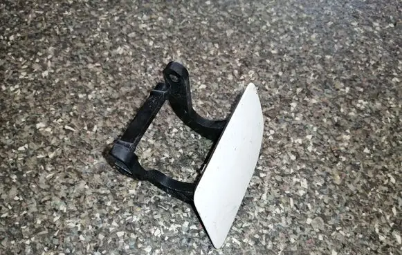 Headlight washer spray nozzle cap/cover