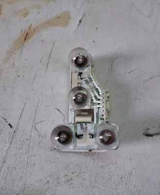 Tail light bulb cover holder