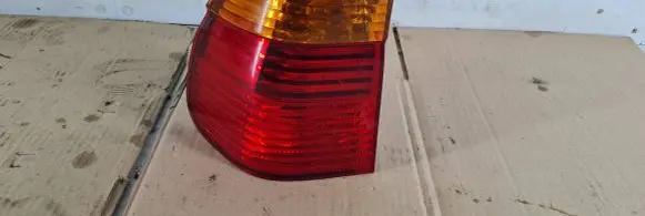 Tail light bulb cover holder