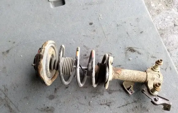 Nissan Primera Front shock absorber with coil spring