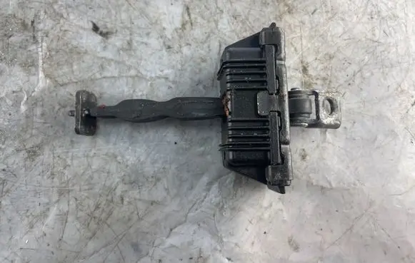 Front door check strap stopper