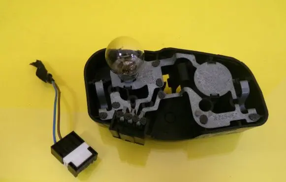 Tail light bulb cover holder