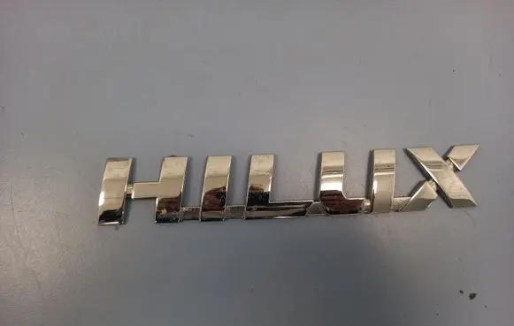 Toyota Hilux (AN10, AN20, AN30) Manufacturer badge logo/emblem 75427