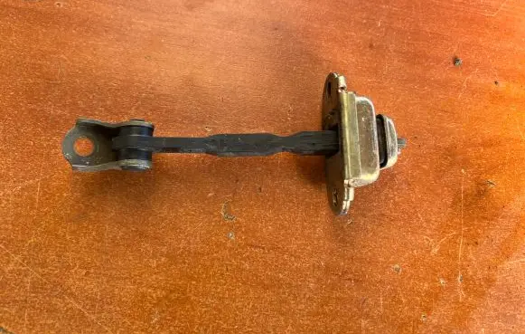 Nissan Almera N16 Front door check strap stopper