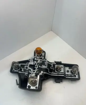 Tail light bulb cover holder
