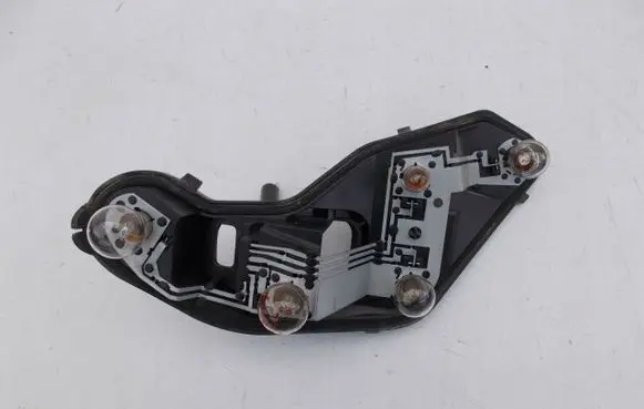 Tail light bulb cover holder