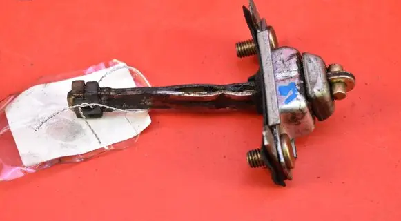 Mazda 626 Front door check strap stopper 