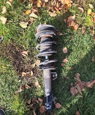Front shock absorber with coil spring