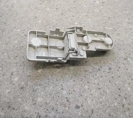 Tail light bulb cover holder