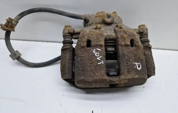 Mitsubishi Colt Front brake caliper 323251545
