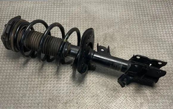 Front shock absorber with coil spring
