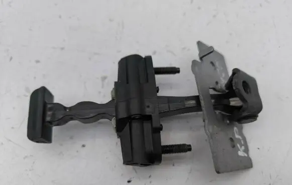 Front door check strap stopper
