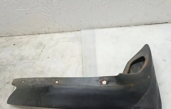 Mercedes-Benz W123 Front bumper corner part panel trim 1238850723