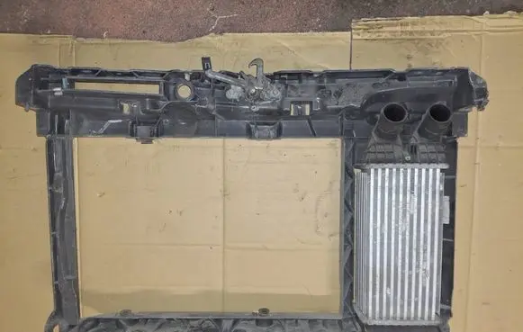 Radiator support slam panel