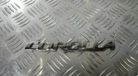 Toyota Corolla E210 E21 Manufacturers badge/model letters 