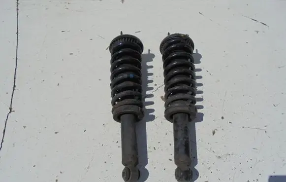 Renault Megane III Rear shock absorber with coil spring MCPERSON