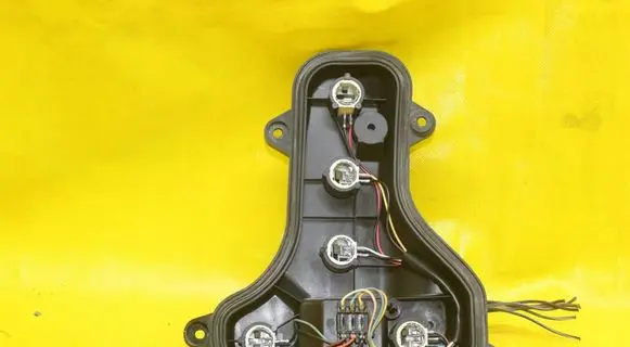 Tail light bulb cover holder
