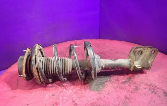Subaru Outback Front shock absorber with coil spring