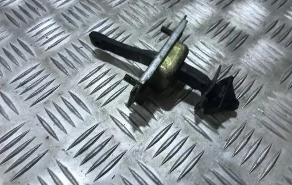 Front door check strap stopper