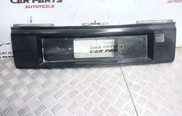 Trunk door license plate light bar