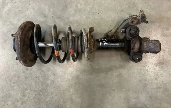 Nissan Primera Front shock absorber with coil spring