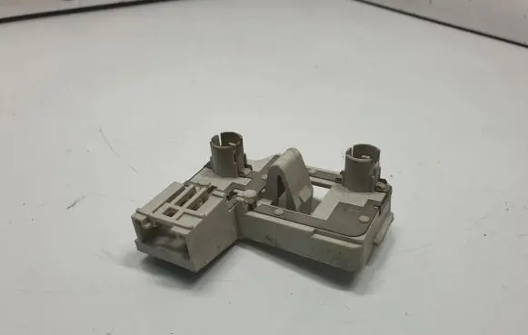 Tail light bulb cover holder