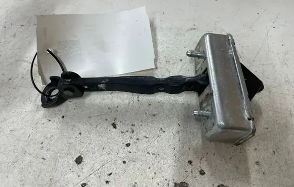 Front door check strap stopper