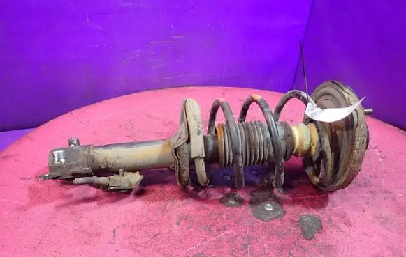 Nissan Primera Front shock absorber with coil spring