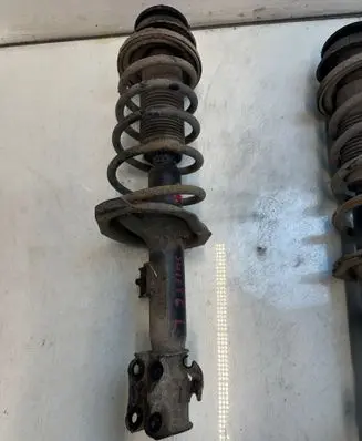 Suzuki Swift I Front shock absorber with coil spring 3212332