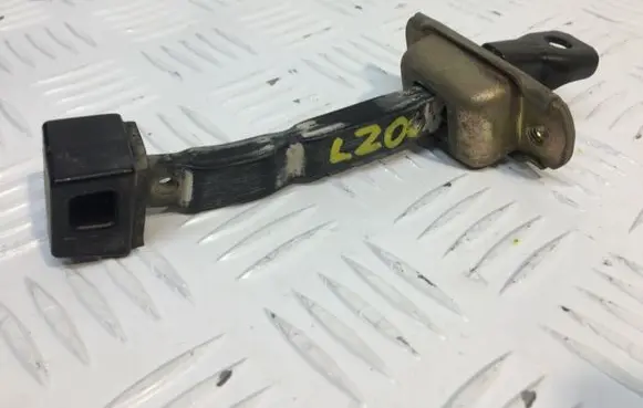 Mitsubishi L200 Rear door check strap stopper