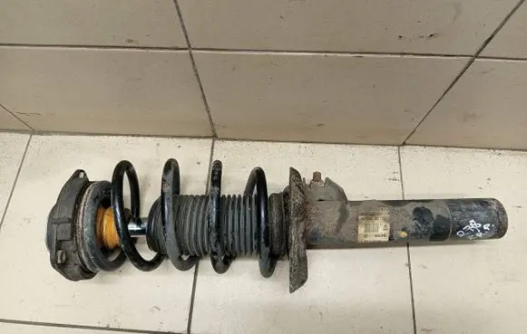 Volkswagen PASSAT B7 Front shock absorber with coil spring