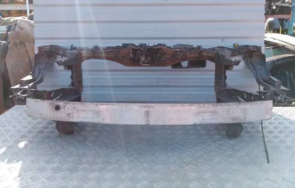 Top upper radiator support slam panel