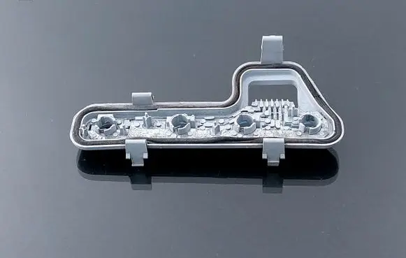 Tail light bulb cover holder
