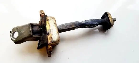 Front door check strap stopper