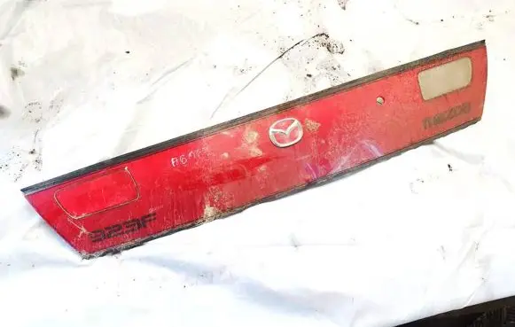 Mazda 323 F Trunk door license plate light bar 