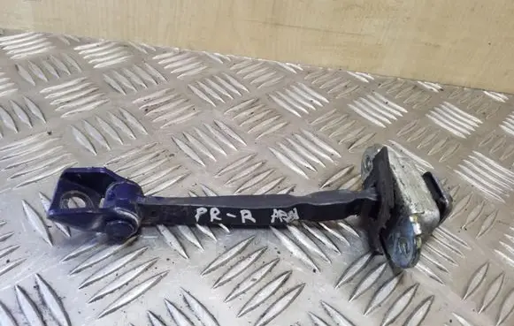 Front door check strap stopper