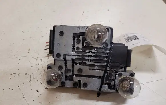 Tail light bulb cover holder