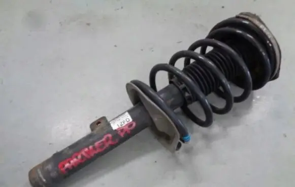Peugeot Partner Front shock absorber with coil spring