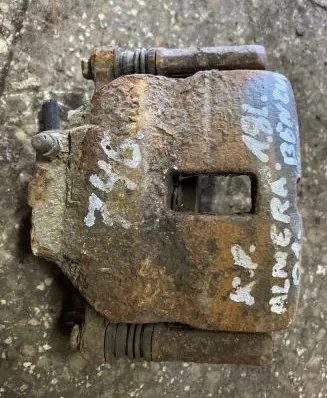 Nissan Almera N16 Front brake caliper