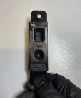 Sliding door check strap stopper