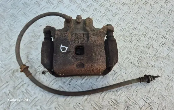 Nissan Juke I F15 Front brake caliper
