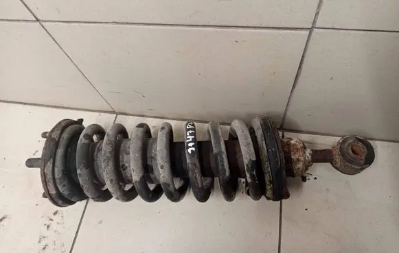 Nissan Pathfinder R51 Front shock absorber with coil spring 