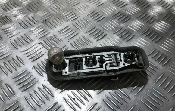 Tail light bulb cover holder
