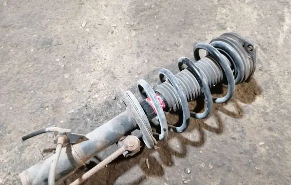 Nissan Qashqai Front shock absorber with coil spring