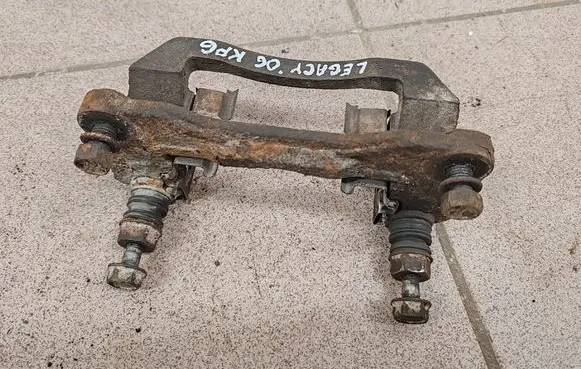 Subaru Legacy Brake caliper pad carrier rear 