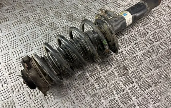 Volkswagen Caddy Front shock absorber with coil spring