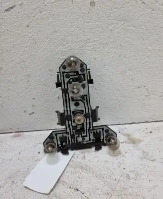 Tail light bulb cover holder